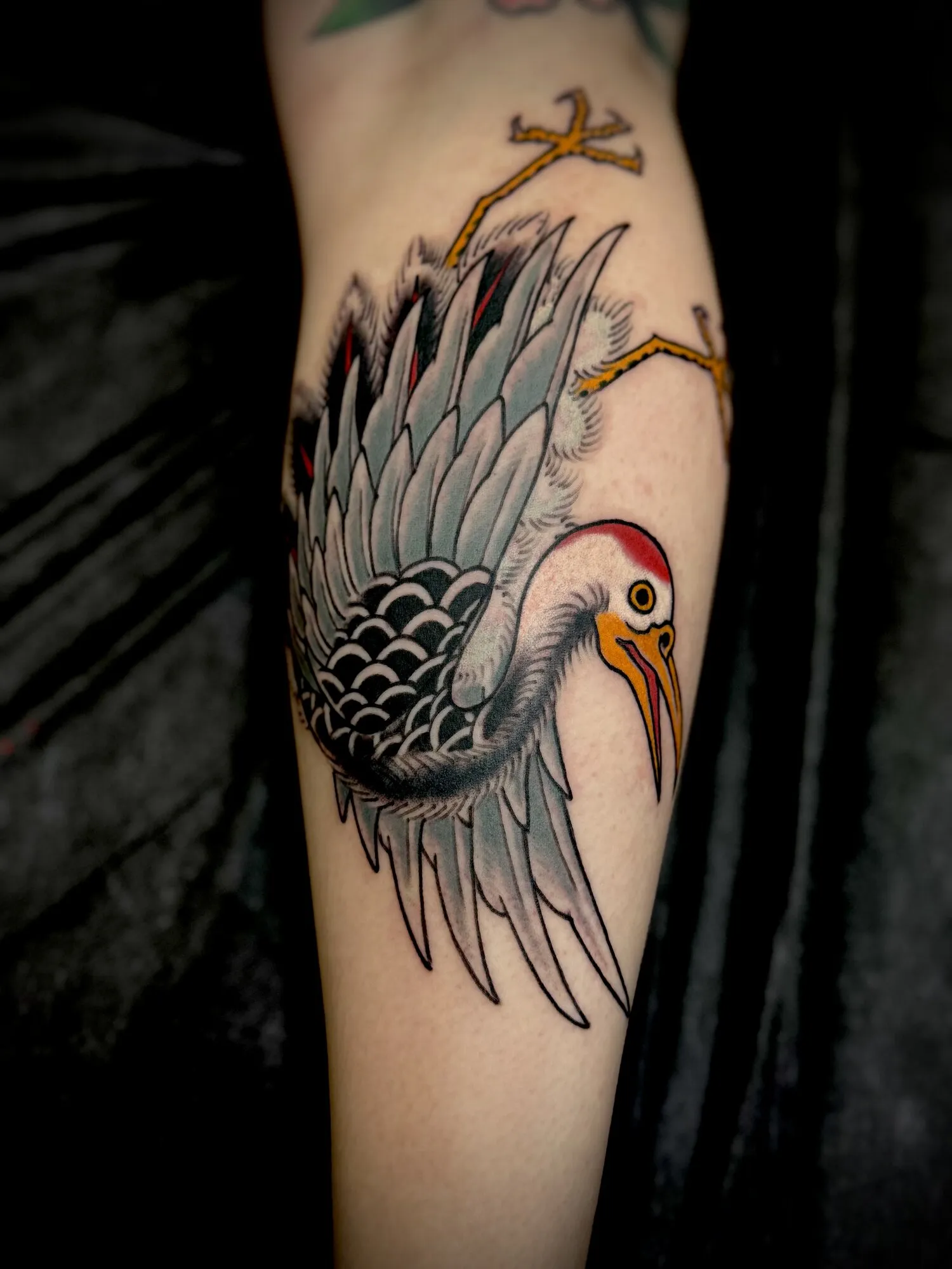American traditional crane bird arm tattoo by Josh Robinson in Dallas, TX