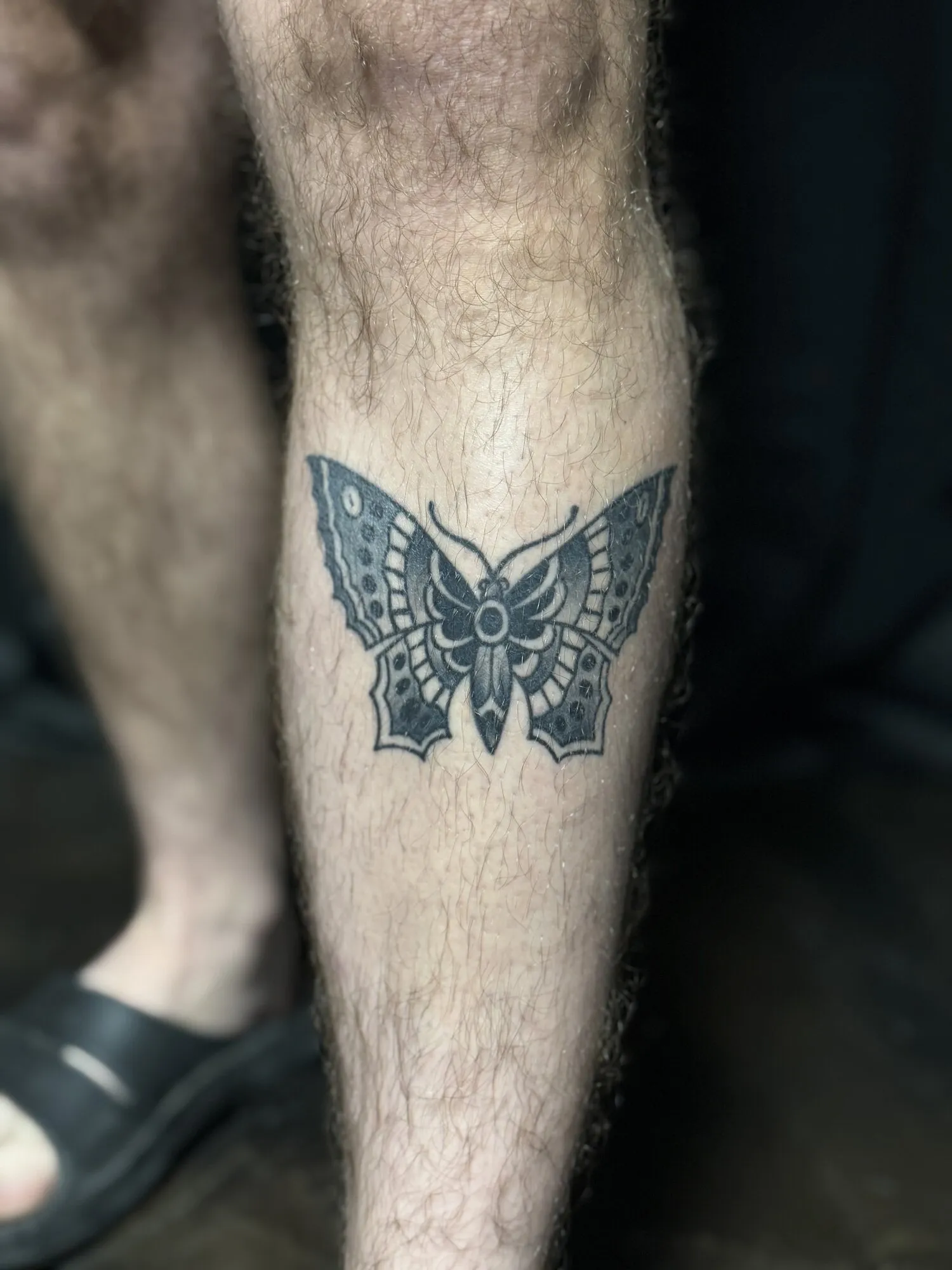 American traditional moth calf tattoo in black and grey by Josh Robinson in Dallas, TX