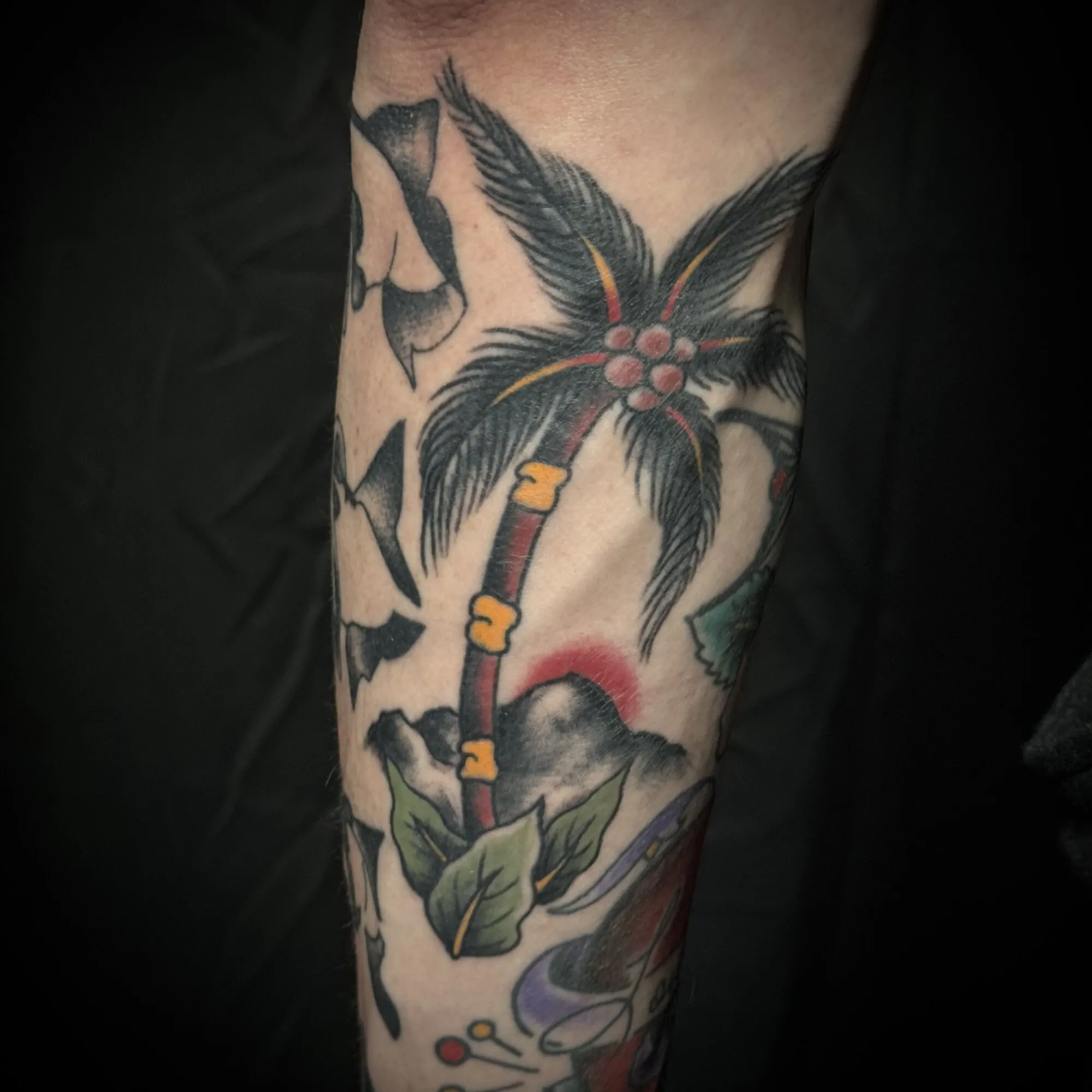 American traditional palm tree and sunset leg tattoo by Josh Robinson in Dallas, TX