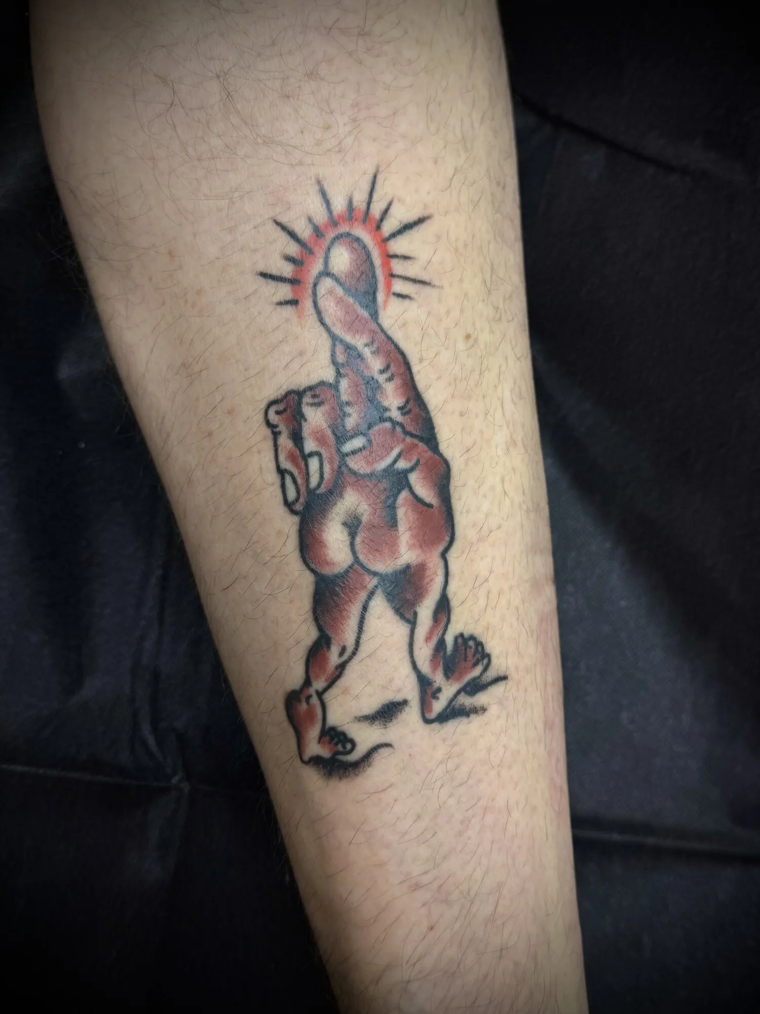 American traditional novelty walking figure arm tattoo by Josh Robinson in Dallas, TX