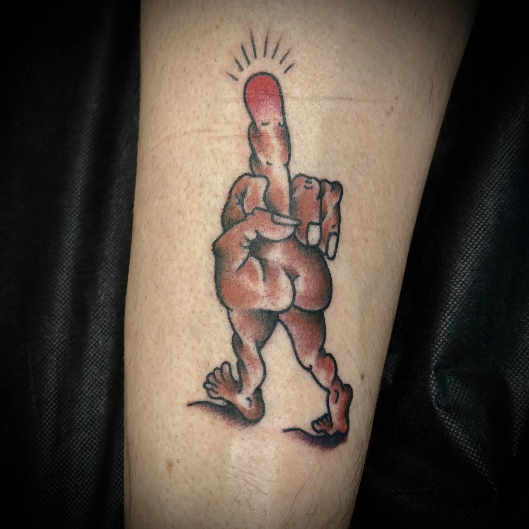 American traditional novelty walking figure forearm tattoo by Josh Robinson in Dallas, TX