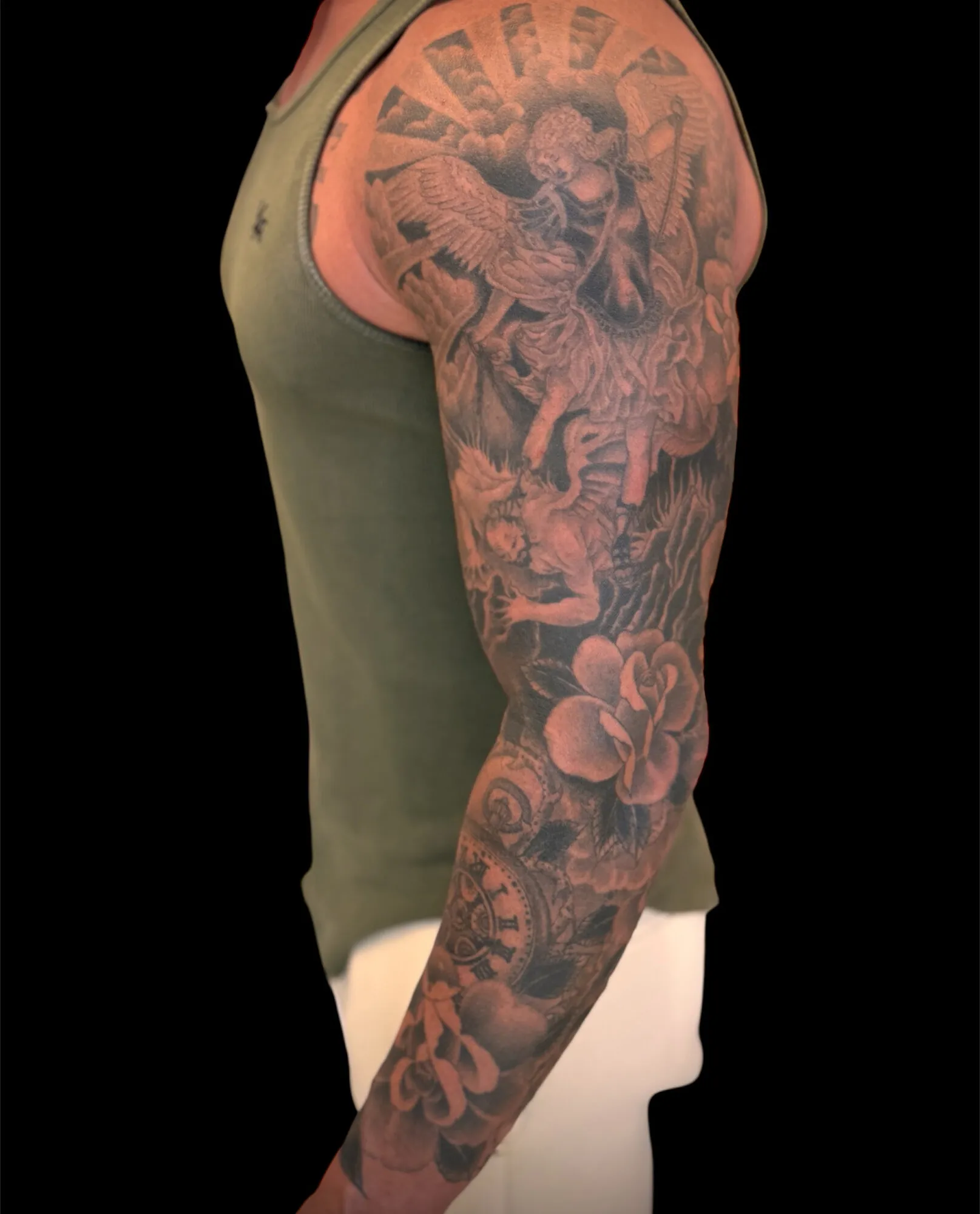 Black and grey angel and roses full sleeve tattoo by Josh Robinson in Dallas, TX