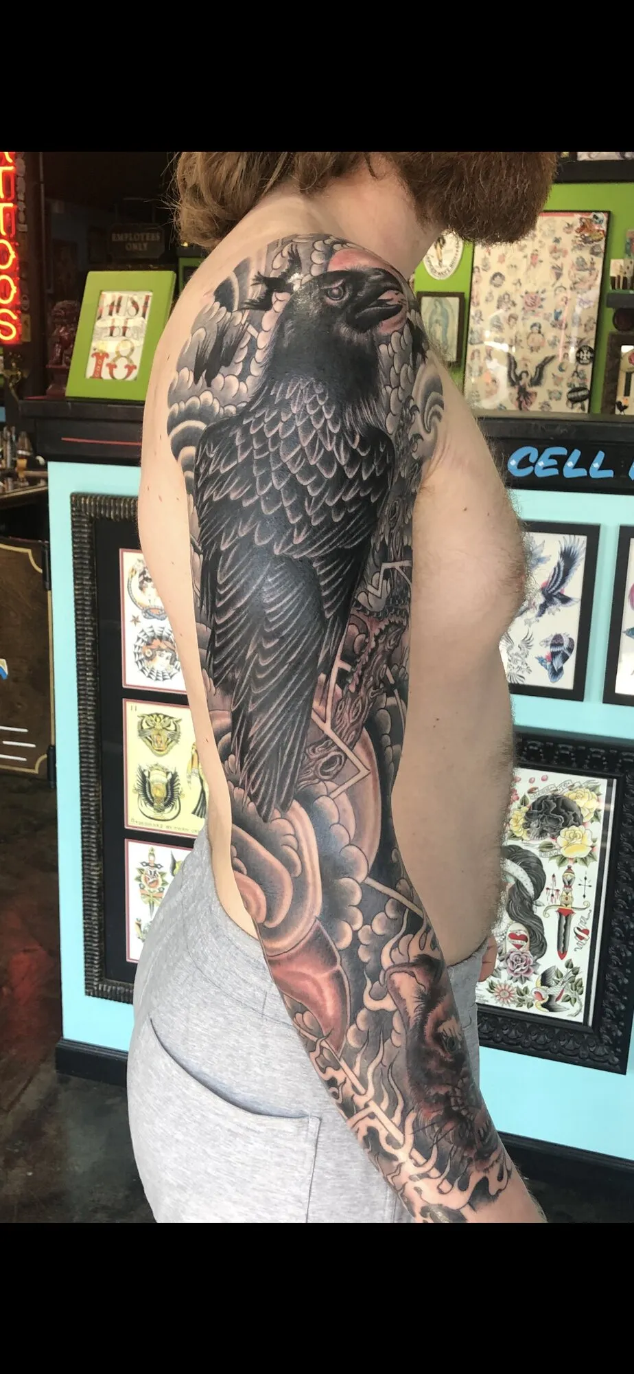 Black and grey raven full sleeve tattoo by Josh Robinson in Dallas, TX