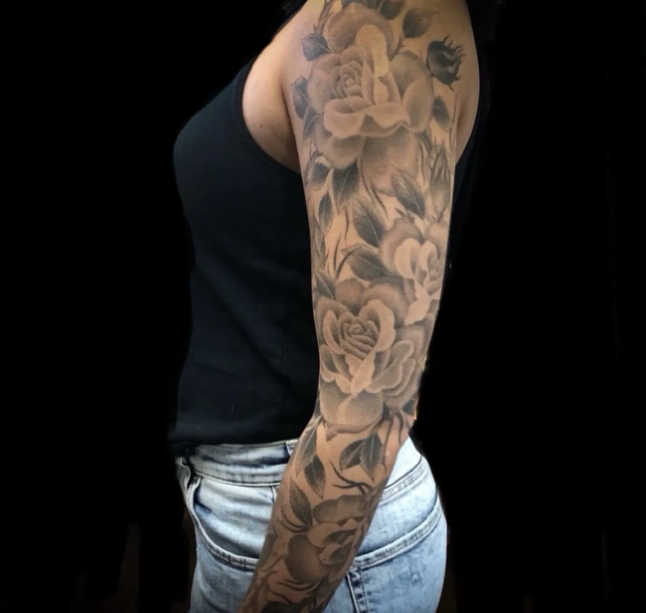 Black and grey rose full sleeve tattoo by Josh Robinson in Dallas, TX