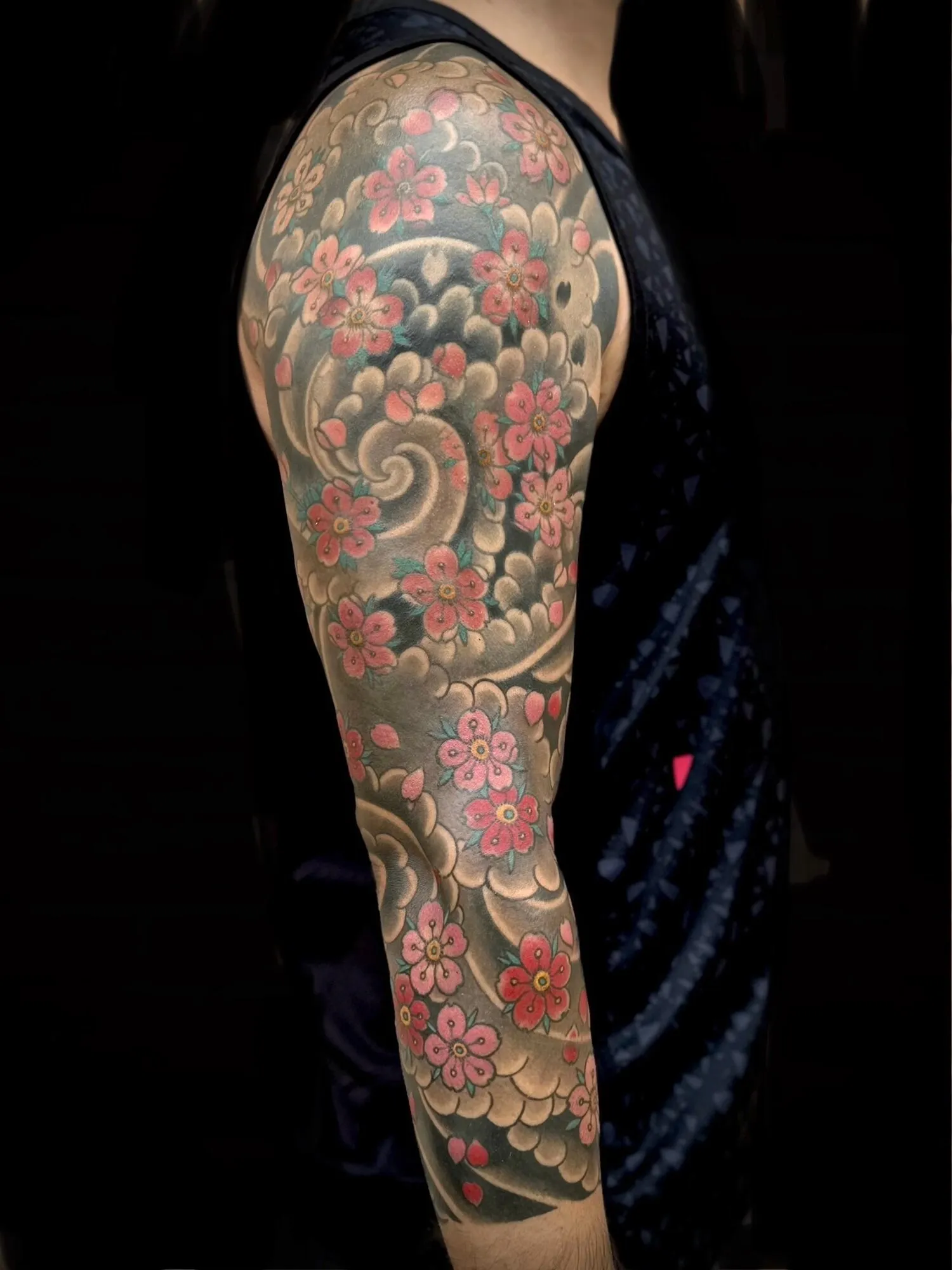 Japanese cherry blossom and clouds full sleeve tattoo by Josh Robinson in Dallas, TX