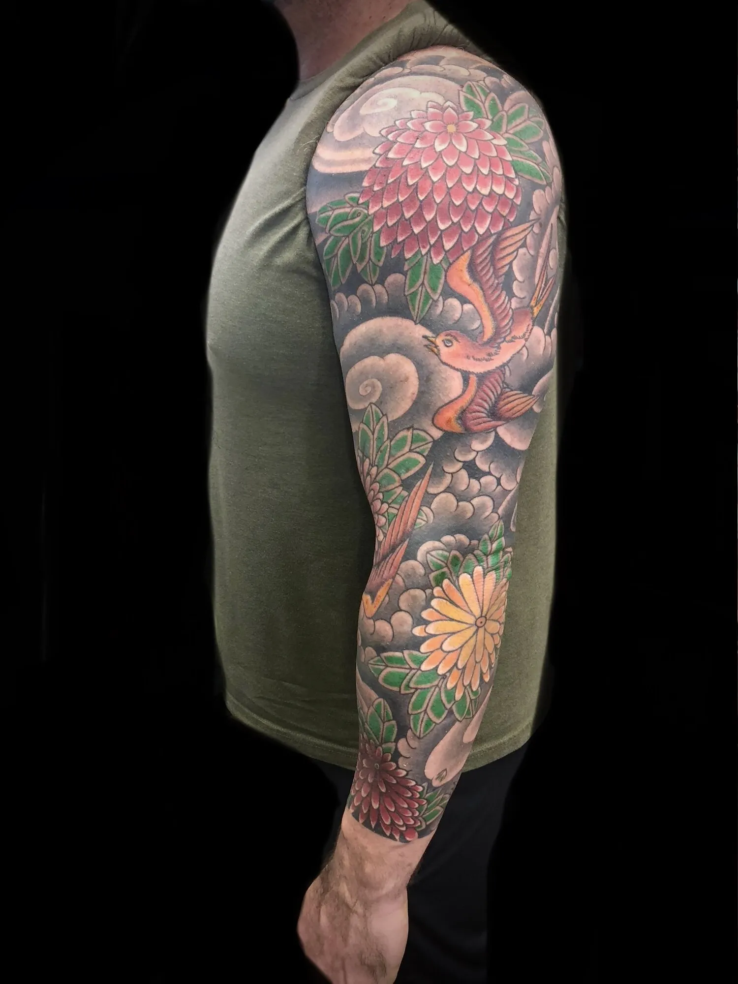 Japanese chrysanthemum and waves full sleeve tattoo by Josh Robinson in Dallas, TX