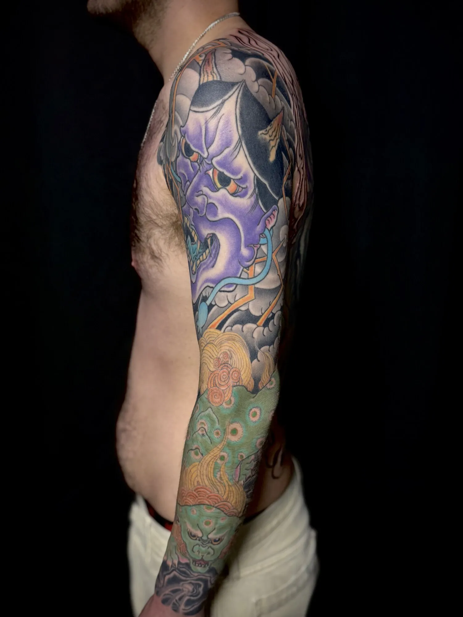 Japanese hannya mask full sleeve tattoo in purple and green by Josh Robinson in Dallas, TX