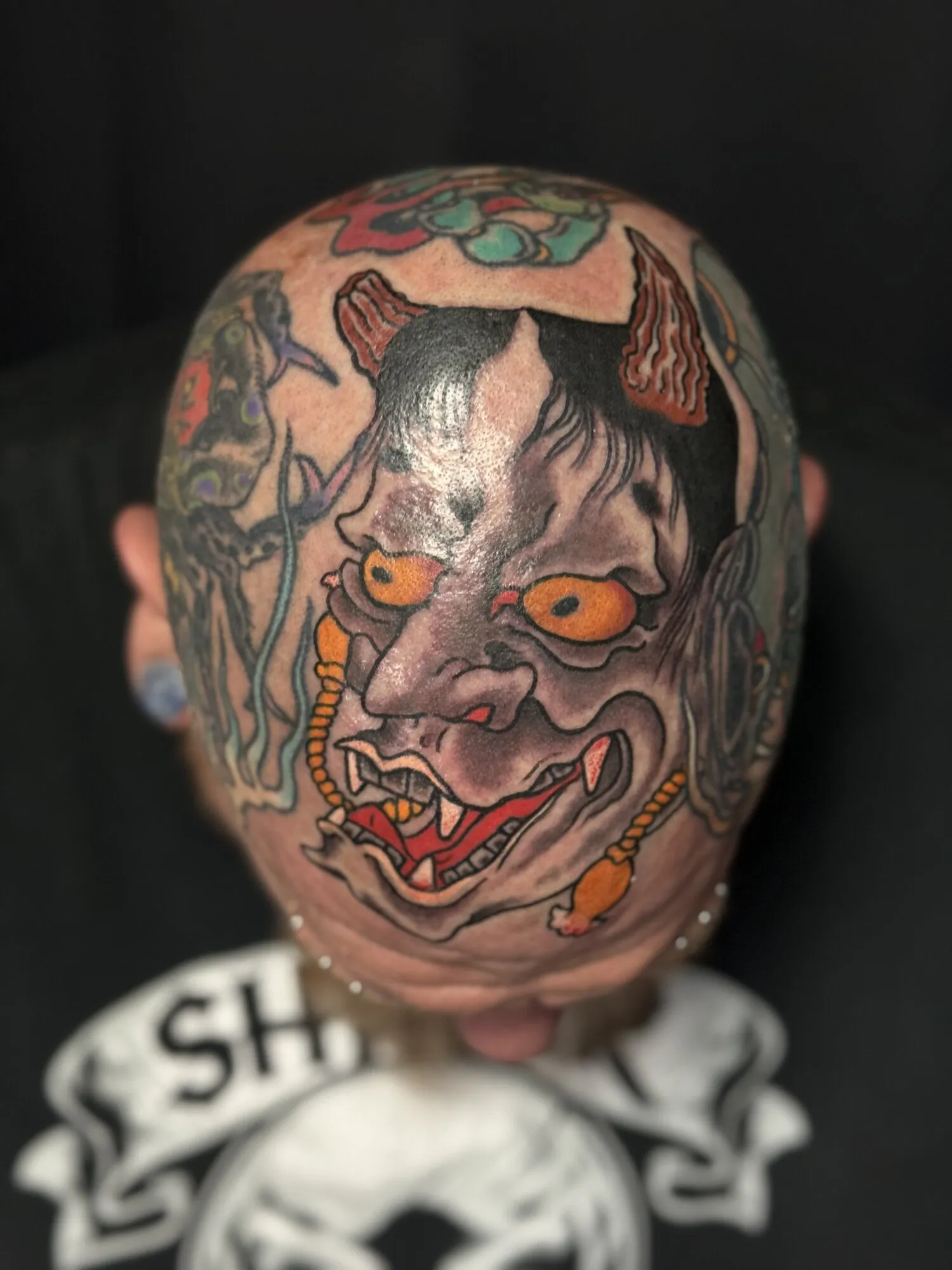 Japanese hannya mask head tattoo in color by Josh Robinson in Dallas, TX