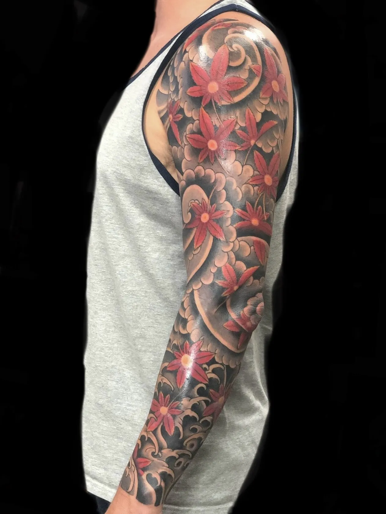 Japanese peony flower full sleeve tattoo in red and black by Josh Robinson in Dallas, TX