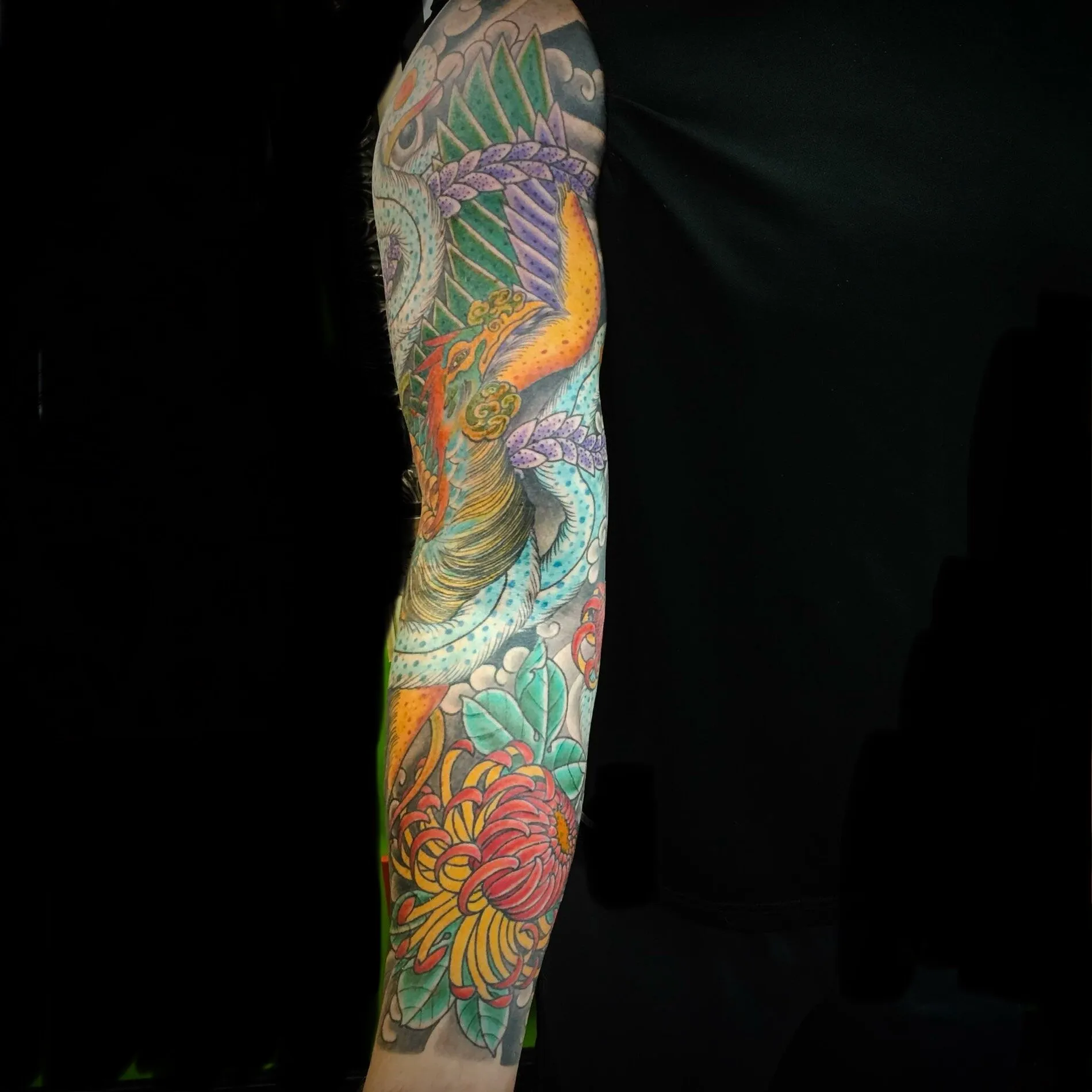 Japanese phoenix and chrysanthemum full sleeve tattoo in color by Josh Robinson in Dallas, TX