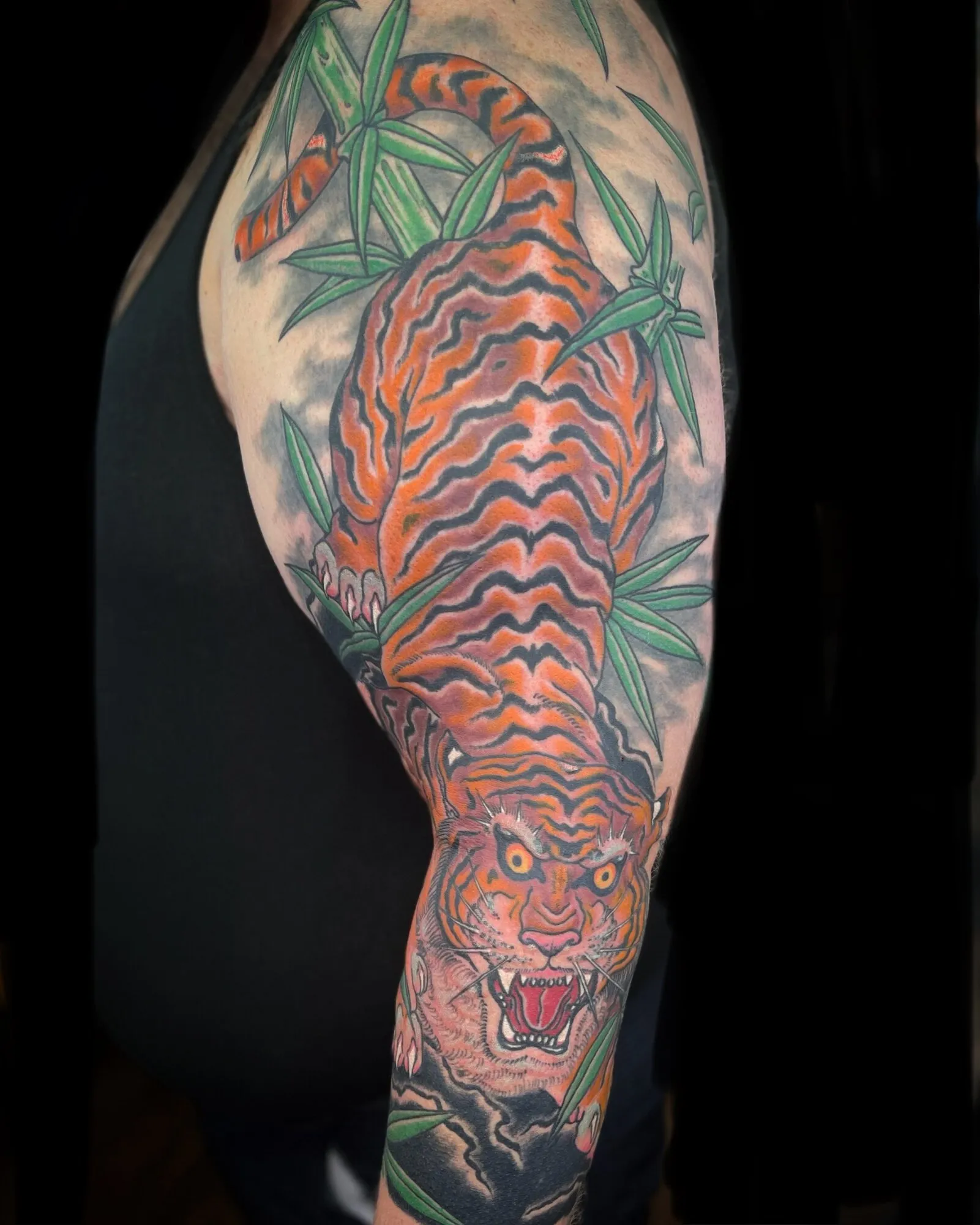 Japanese tiger and bamboo sleeve tattoo in orange and black by Josh Robinson in Dallas, TX