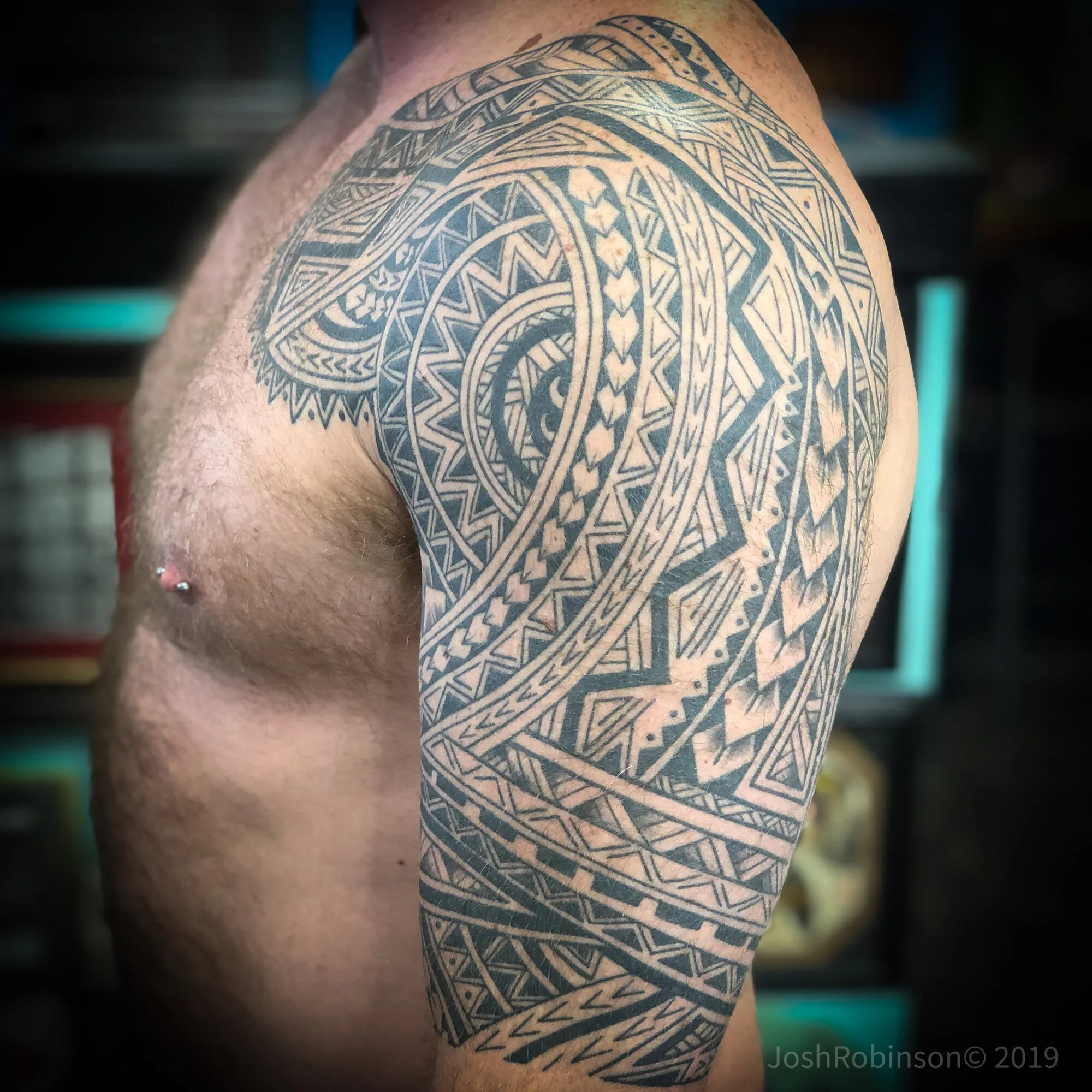 Polynesian tribal shoulder and half sleeve tattoo by Josh Robinson in Dallas, TX