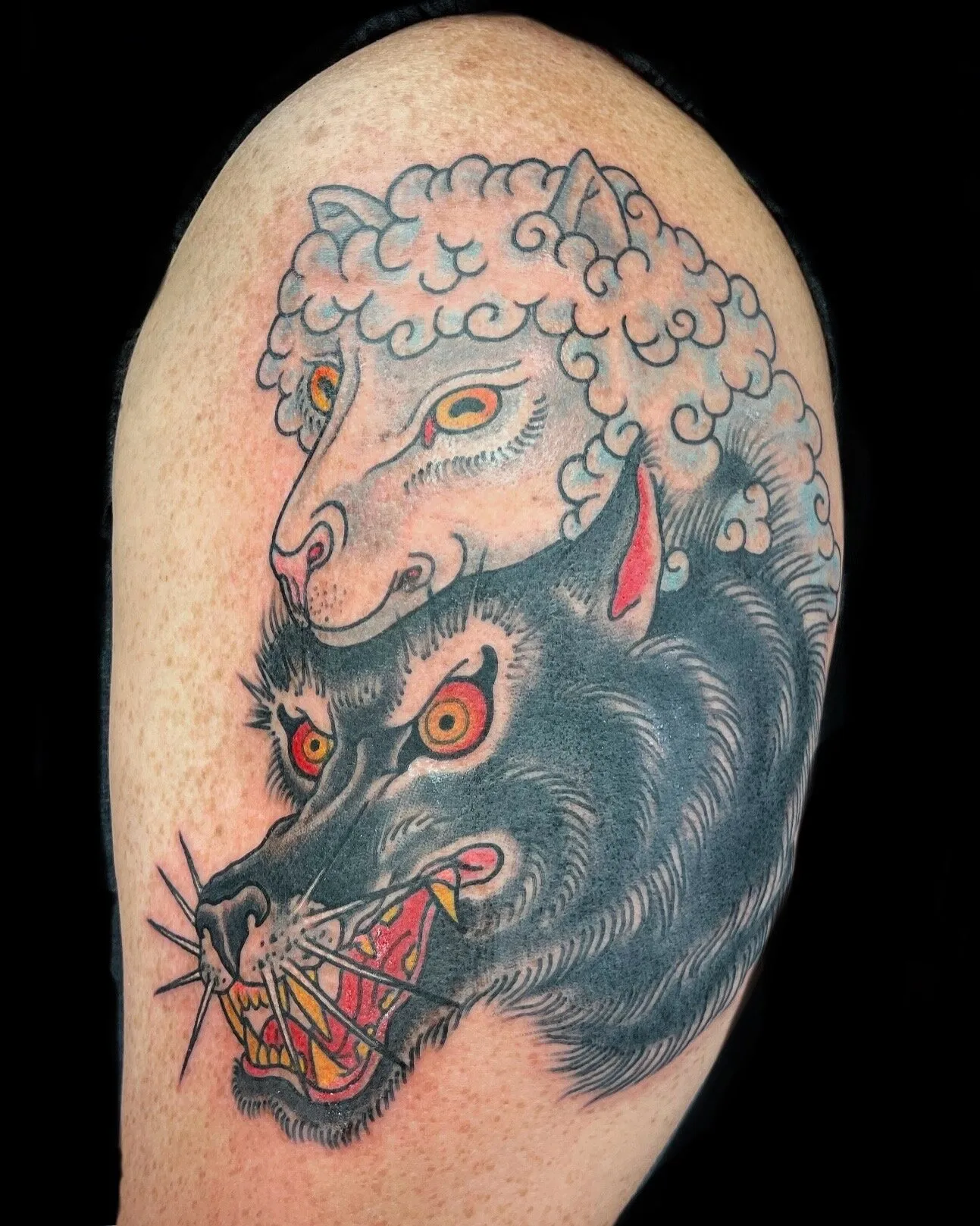 Traditional wolf in sheep's clothing half sleeve tattoo by Josh Robinson in Dallas, TX